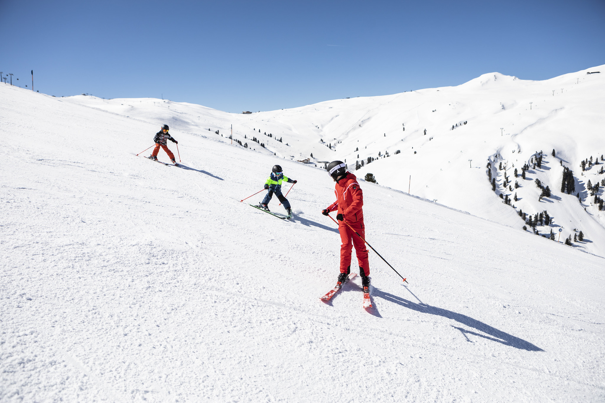 People skiing on a snowy mountain People skiing on a snowy mountain