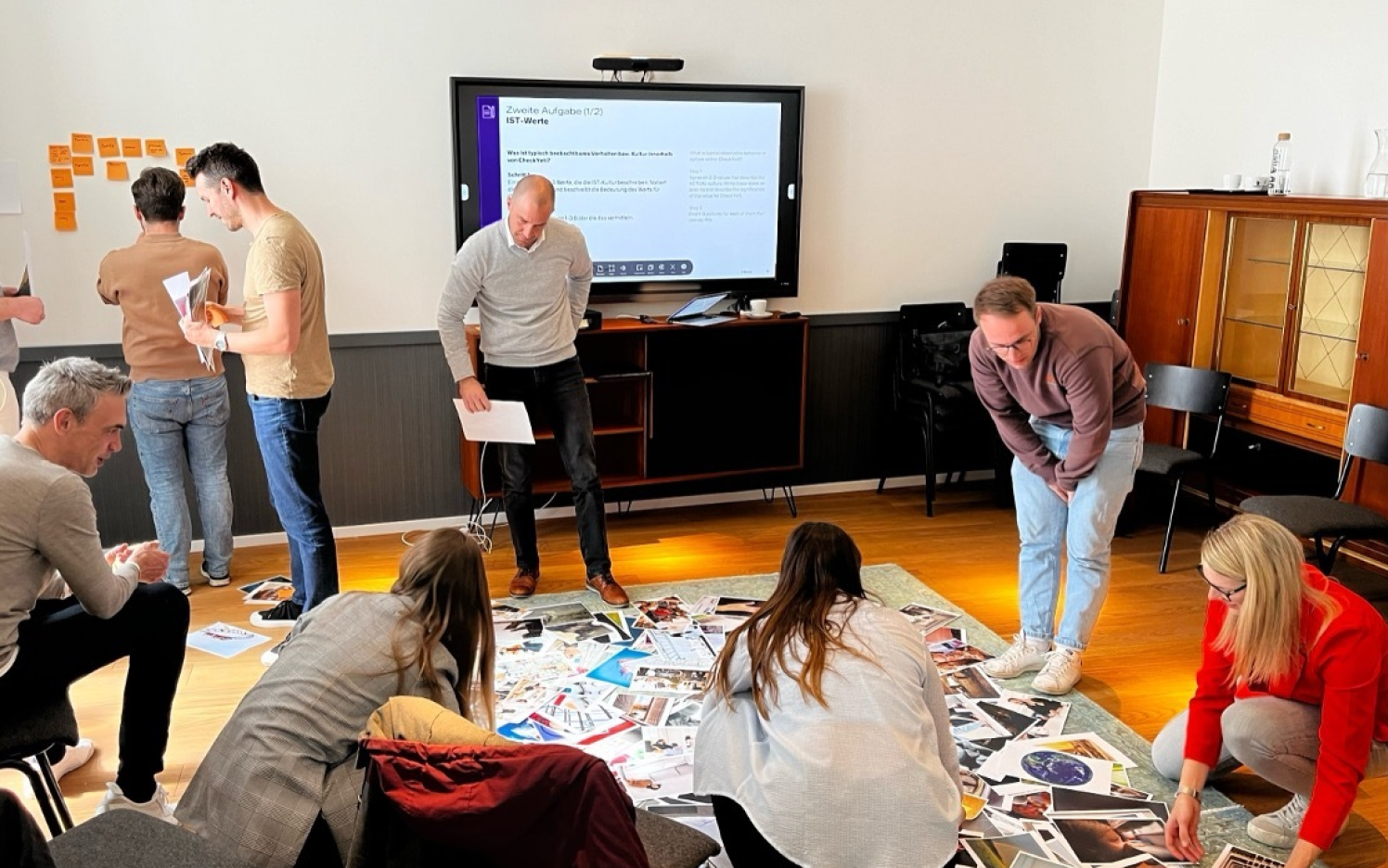 Core team members of checkyeti working on the new brand in a design workshop.