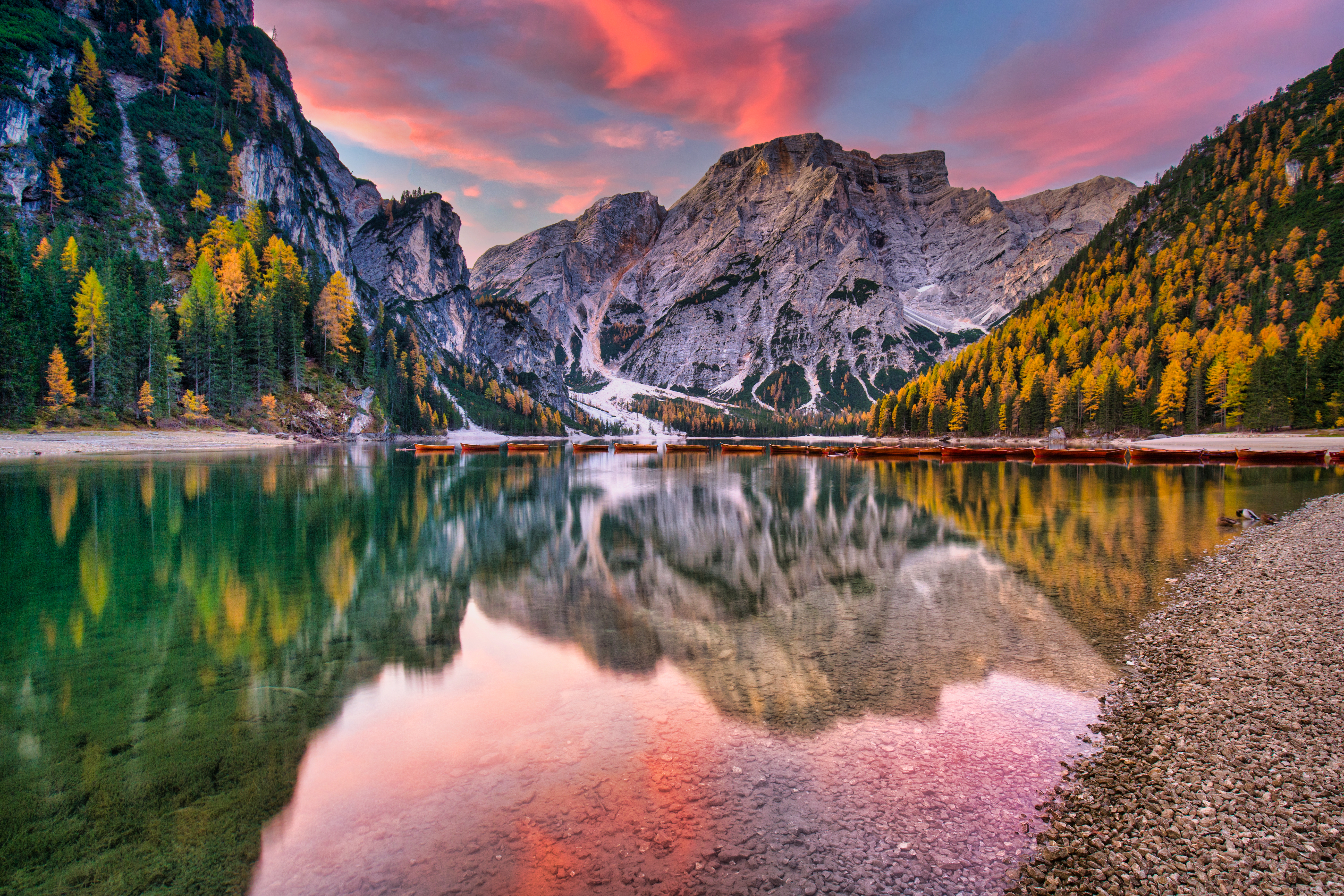 You are discovering your next outdoor adventure with checkyeti at a beautiful lake surrounded by mountains and impressive nature