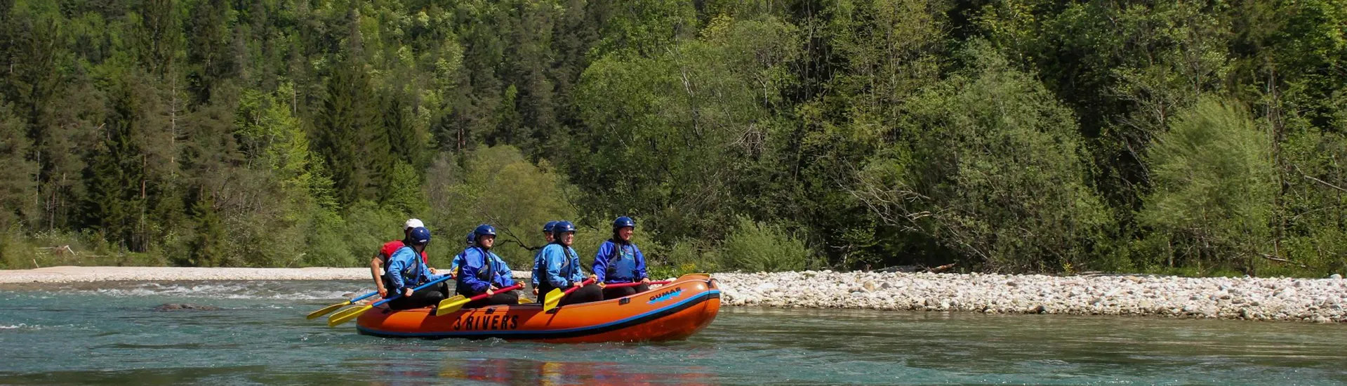 3 Rivers Bled A raft with a group of adventurers exploring the river in Bled during a rafting tour with 3 Rivers Bled.