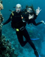 scuba divers give the OK sign during a diving session in Split.