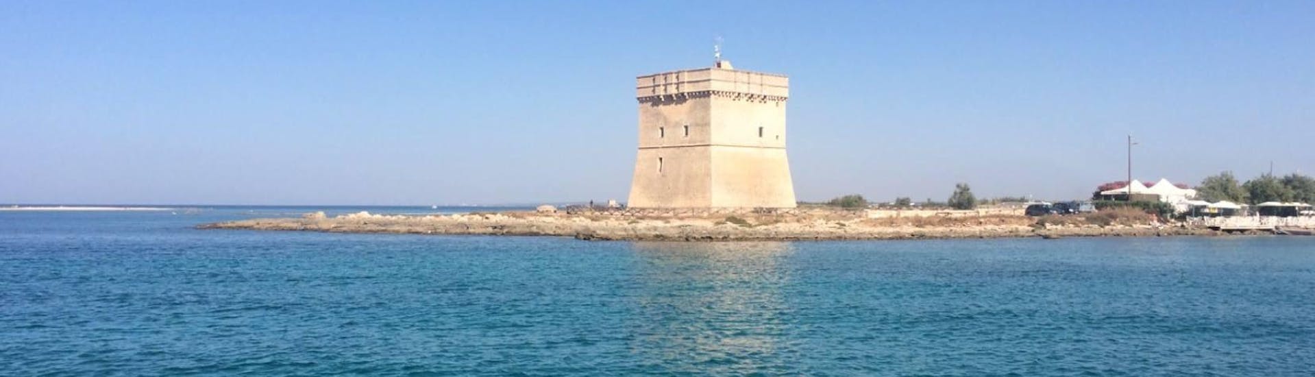 The mighty tower of Torre Chiana can be admired during our catamaran boat trip from Porto Cesareo.