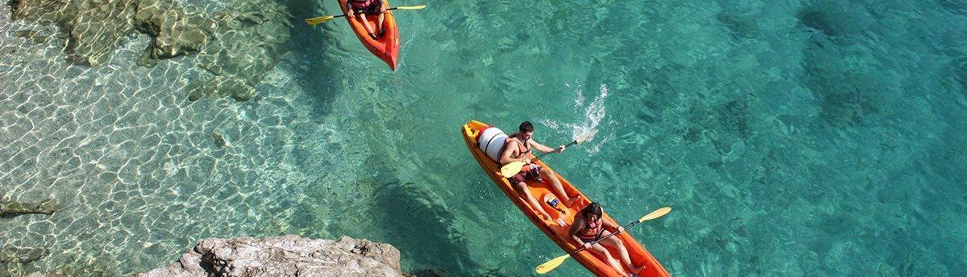 Tourists are paddling along spectacular coastal rocks during a sea kayaking tour in Dalmatia organised by Adventure Dalmatia.