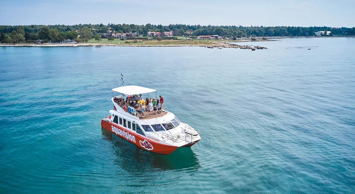 Aquavision Glassbottom Umag Aquavision's Glassbottom Catamaran with people on the sundeck.