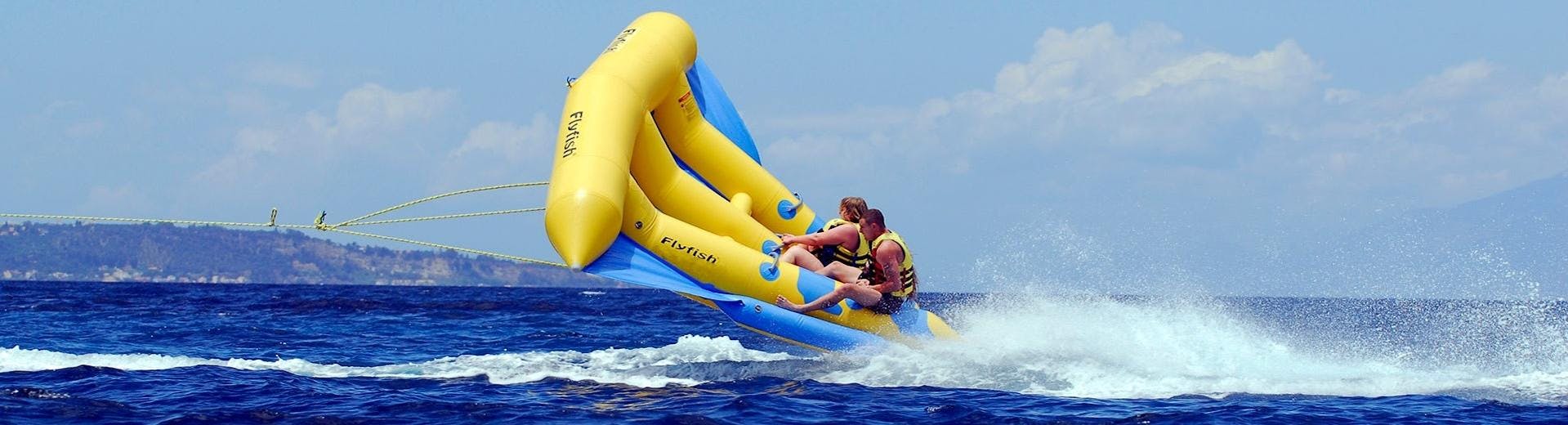 People enjoying aboard an inflatable at Banana Beach.