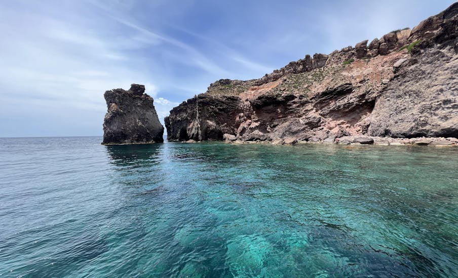 View of the beautiful coastline and crystal-clear waters of Sardinia with Blue Wave Sant'Antioco.