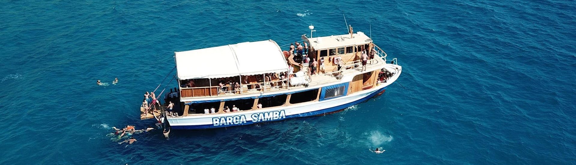 People enjoy a boat trip around Palma de Mallorca with Barca Samba. 