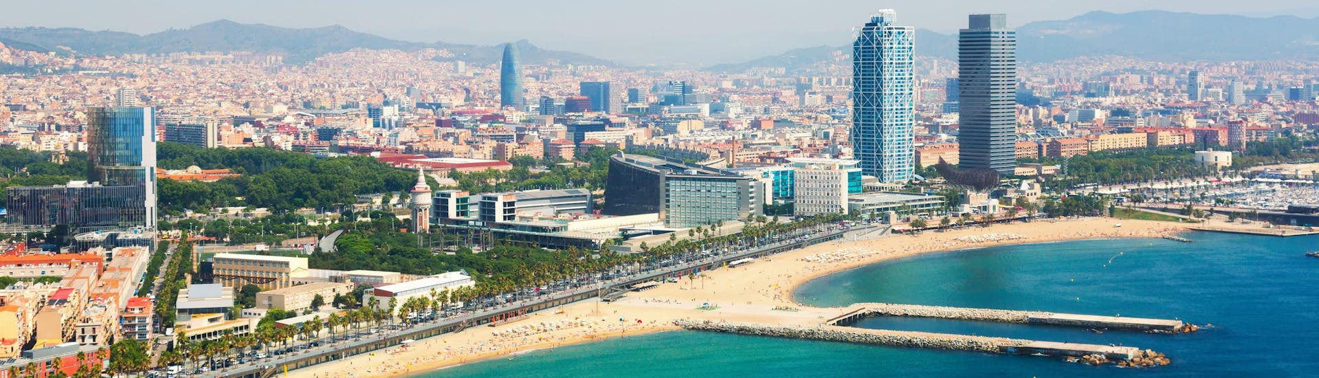 An aerial view of the Barcelona waterfront that you can see on a boat trip in Barcelona.