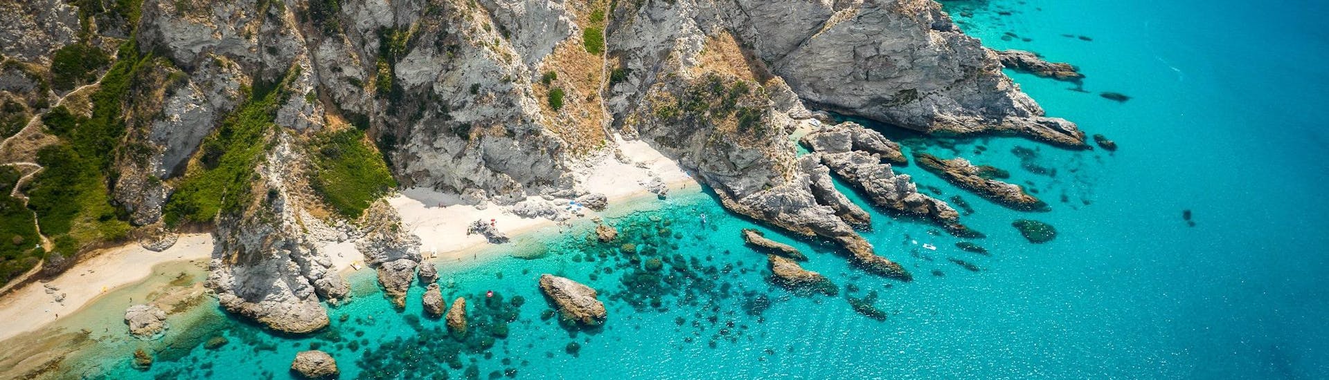 Aerial view over the rocky Capo Vaticano, which is a popular destination for boat trips along the Costa degli Dei in Calabria.