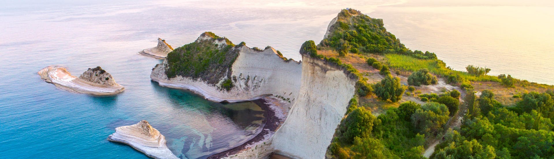 An image of beautiful Cape Drastis, one of the places one might visit on a boat trip in Corfu.