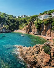 Picture of a paradisiacal cove on the Costa Brava in summer.