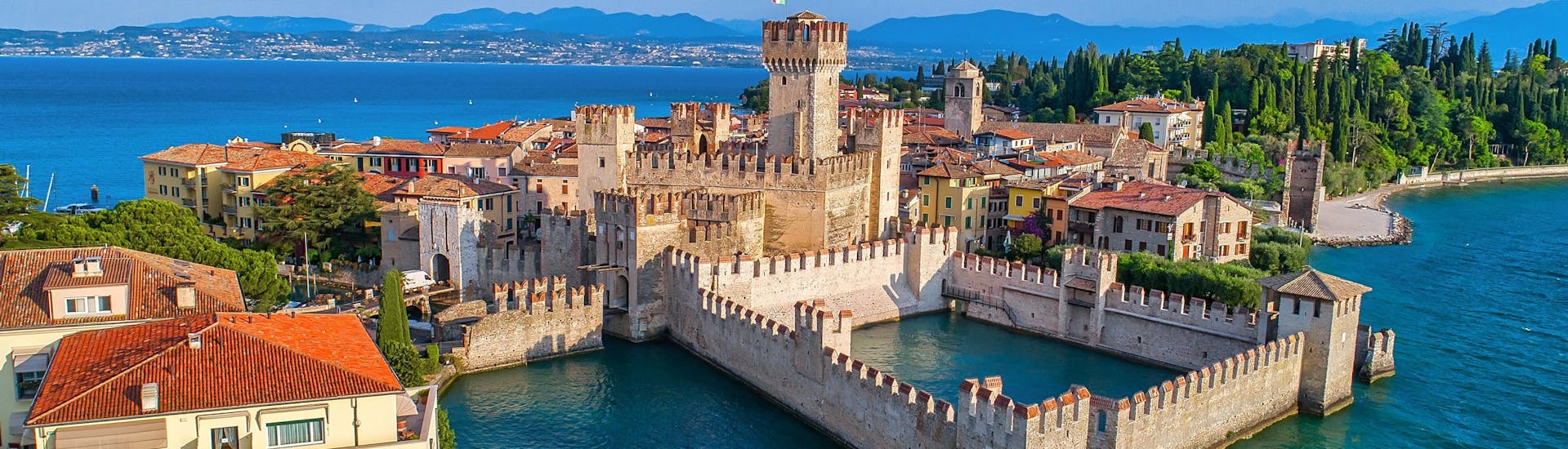 An aerial view of the Scaligero Castle in Sirmione, one of the sights you can see on a boat trip from Desenzano del Garda.