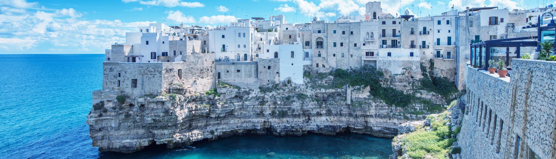 An image of the turquoise waters that visitors get to witness on a boat trip from Polignano a Mare.