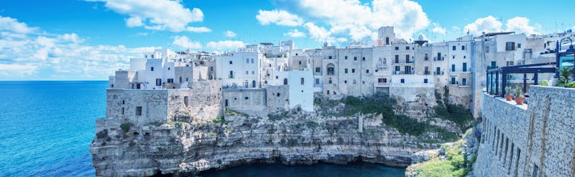 An image of the turquoise waters around Polignano a Mare that visitors get to witness on a boat trip in Puglia.