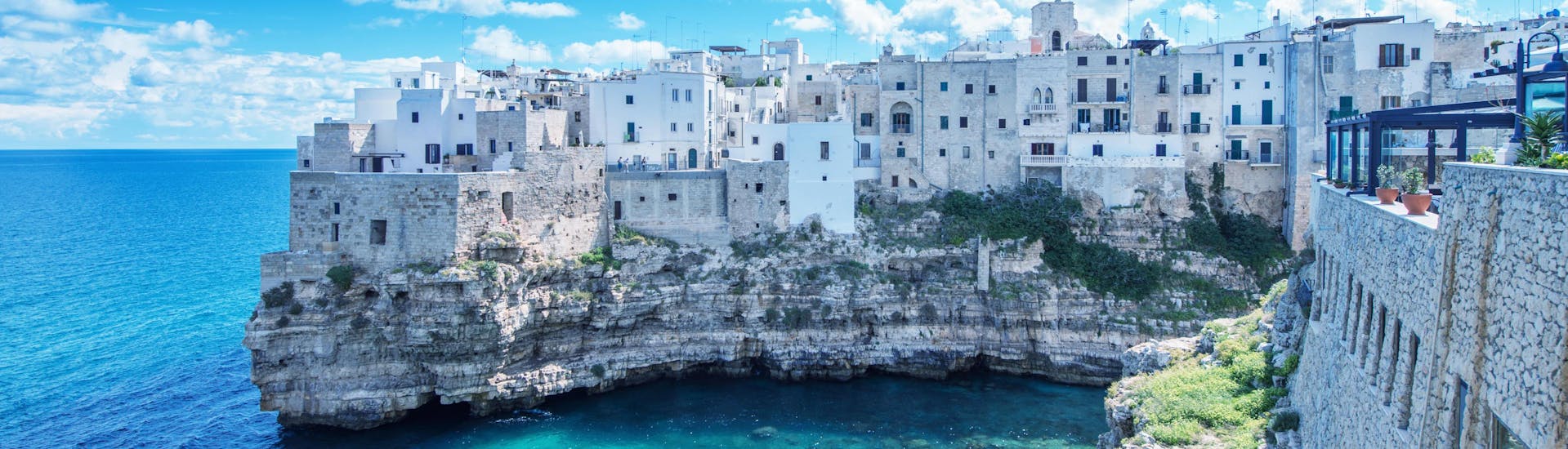 An image of the turquoise waters around Polignano a Mare that visitors get to witness on a boat trip in Puglia.