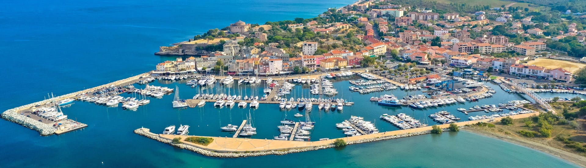 An aerial view of the port of Saint-Florent in the north of Corsica, where many boat trips to Cap Corse are starting.