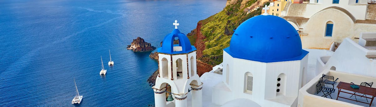 boat-trip-santorini_SEM-Resort-Hero1 An aerial view of the caldera you get to see on a boat trip in Santorini.