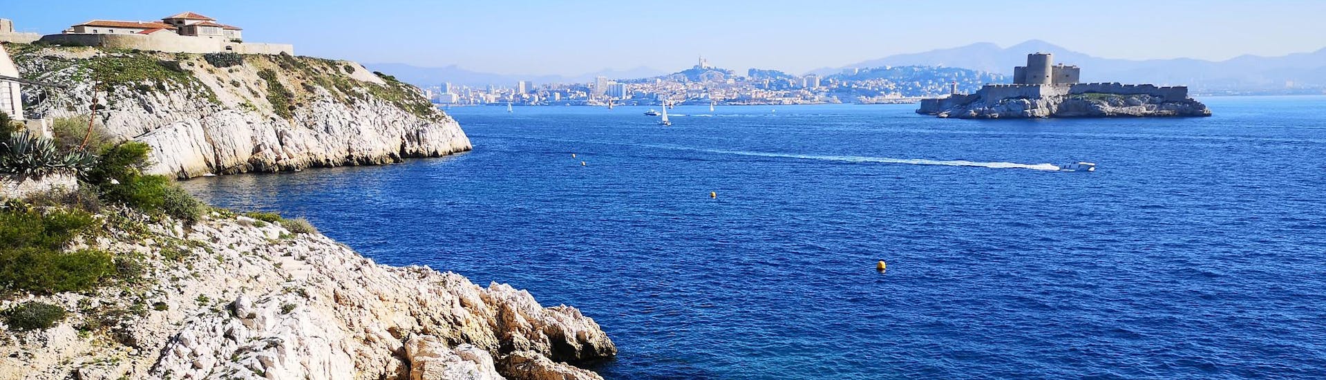 View of Marseille and Château d'If, seen from the Frioul archipelago, which is a popular destination for boat trips.