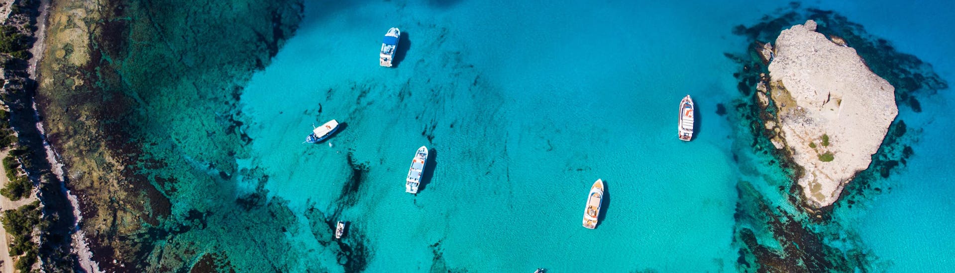 Aerial view over the blue lagoon, a popular destination of boat trips from Latchi.