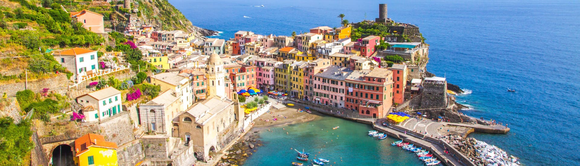 View of the colorful port of Liguria, Cinque Terre, a popular destination for boat tours.