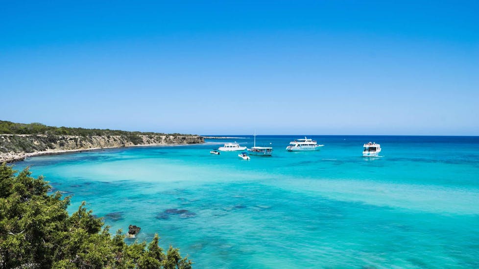Several boats at anchor in the Blue Lagoon of Cyprus in Akamas.