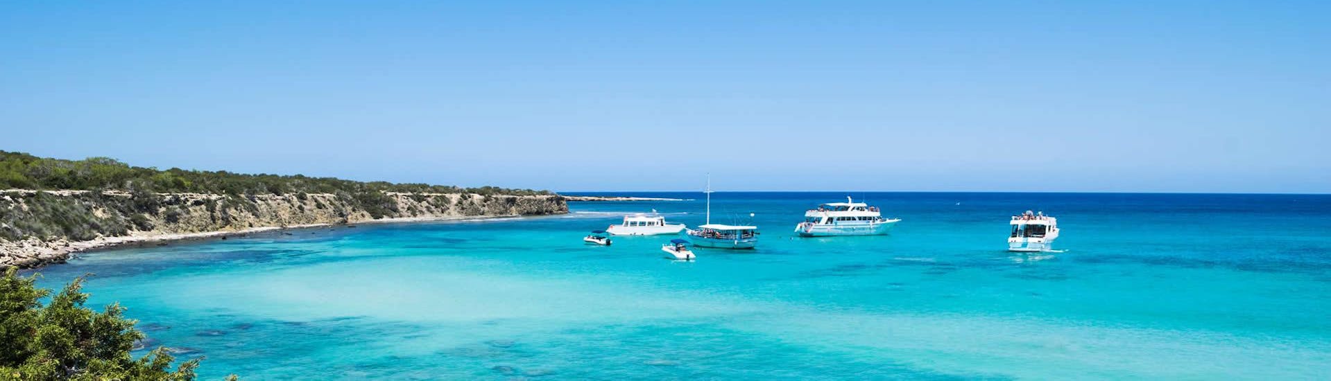 Several boats at anchor in the Blue Lagoon of Cyprus in Akamas.