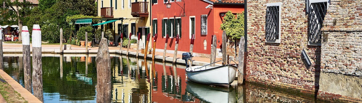 Boat Trips to Torcello Island SEM Hero A boat in the canal during a boat trip to Torcello.