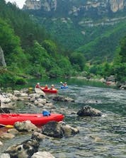 Friends are enjoying the natural wonders of the Tarn Gorges during their Canoe Rental on the Tarn River - Adventure 18km with Canoë Aigue Vive Gorges du Tarn.