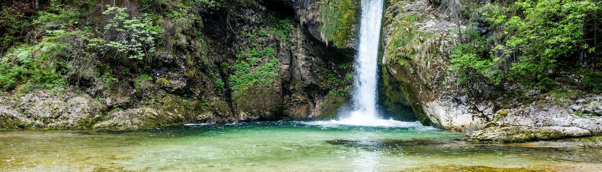 An image of a waterfall in the Grmečica gorge, a popular place to go canyoning near Bled.