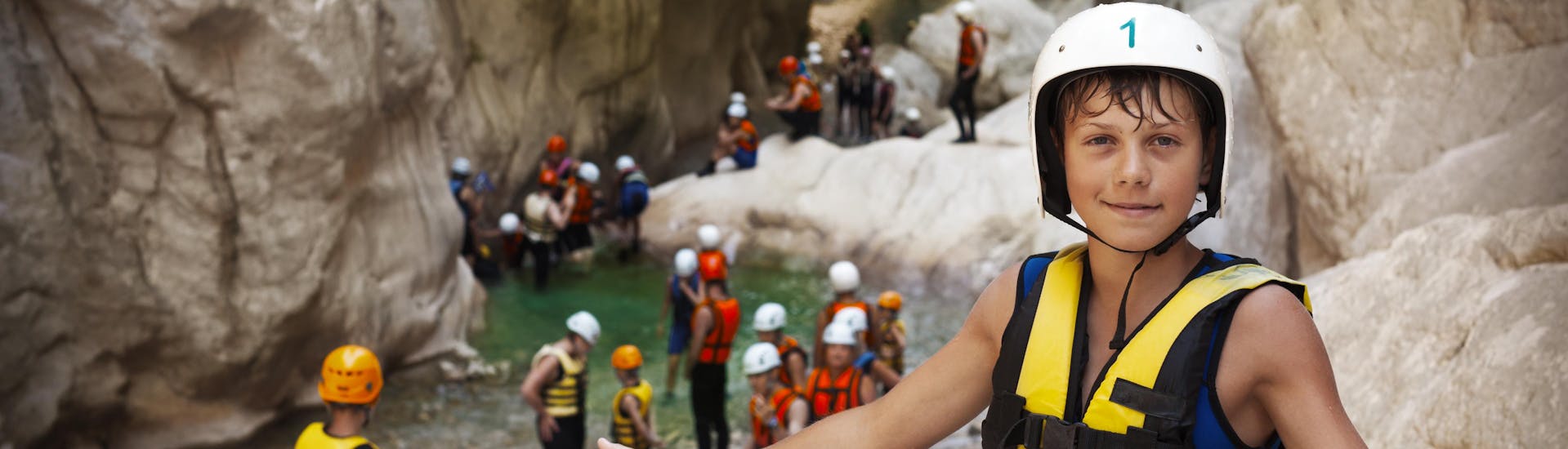 Kids on a canyoning tour with their family