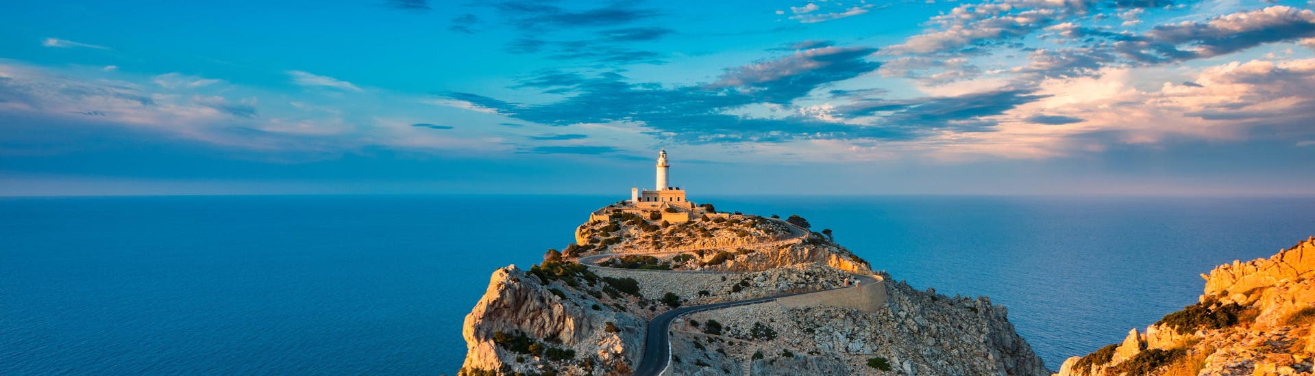 Cap de Formentor and the lighthouse in the background at sunrise.