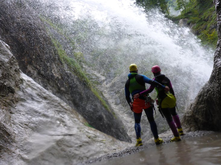 Two people enjoying the fascinating view of the Taxaklamm on their Canyoning Tour with an experienced instructor from CIA Canyoning in Austria & more Adventures.