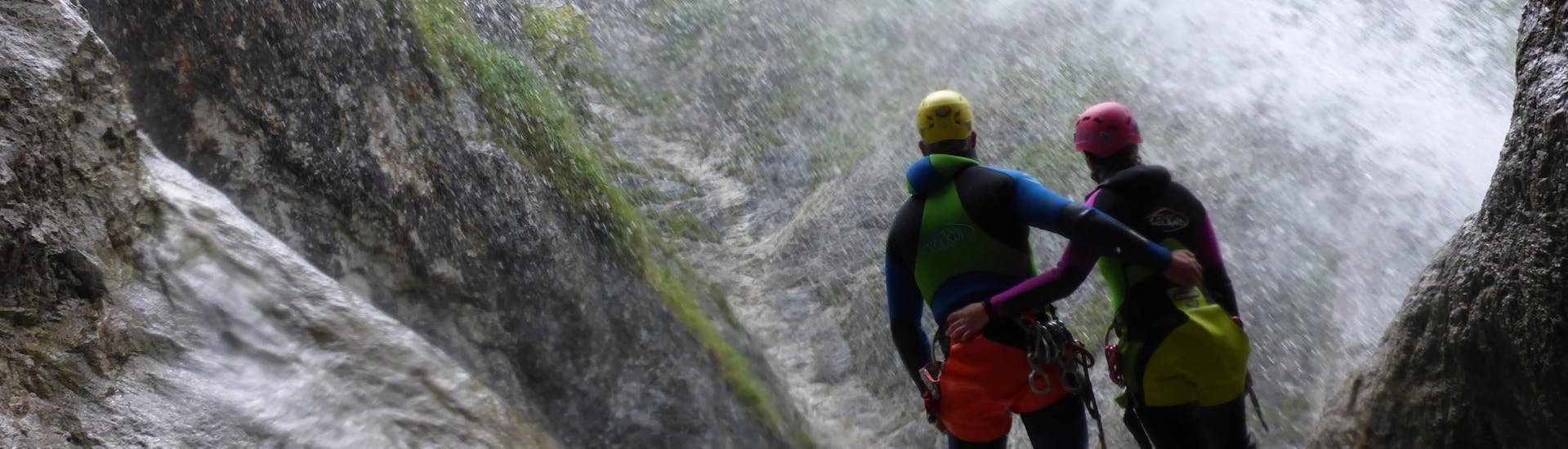 Two people enjoying the fascinating view of the Taxaklamm on their Canyoning Tour with an experienced instructor from CIA Canyoning in Austria & more Adventures.