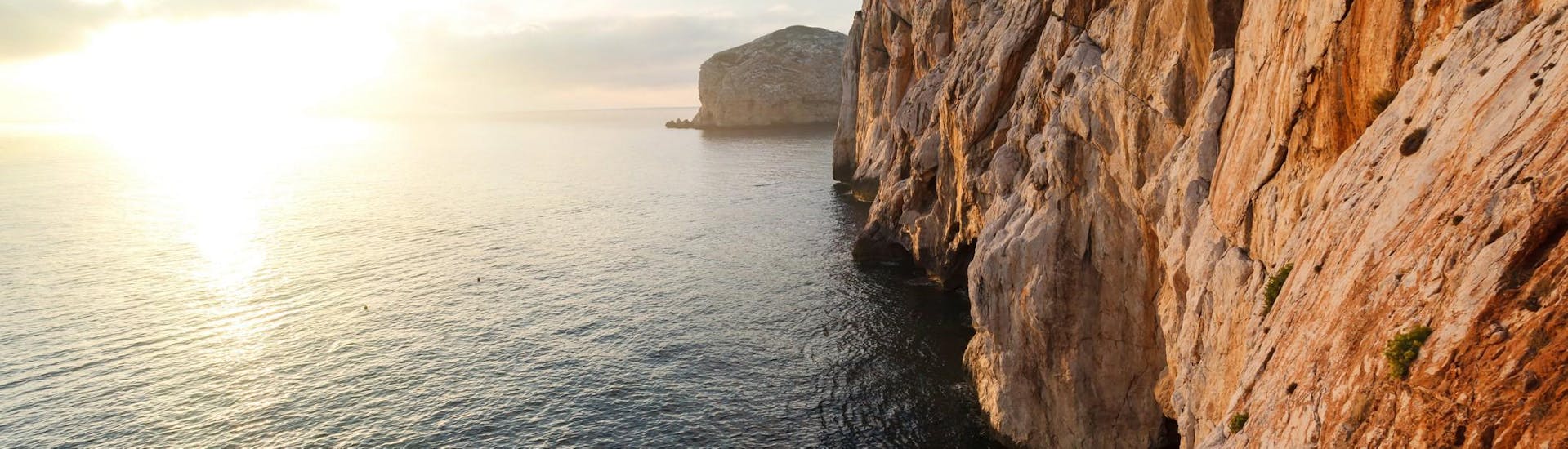 Stunning photo of the entrance to Neptune's Caves visible during a boat ride with Coral Sail Alghero.
