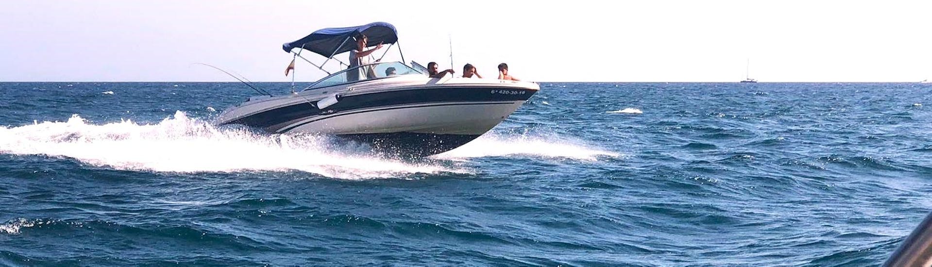 A participant cruising along the Alboran Sea, on a luxury yacht during a boat rental in Mallorca with Marbella Renting Boat.