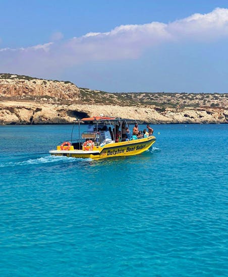 A motorboat from Dolphin Boat Safari, navigating in the stunning coast of Ayia Napa.