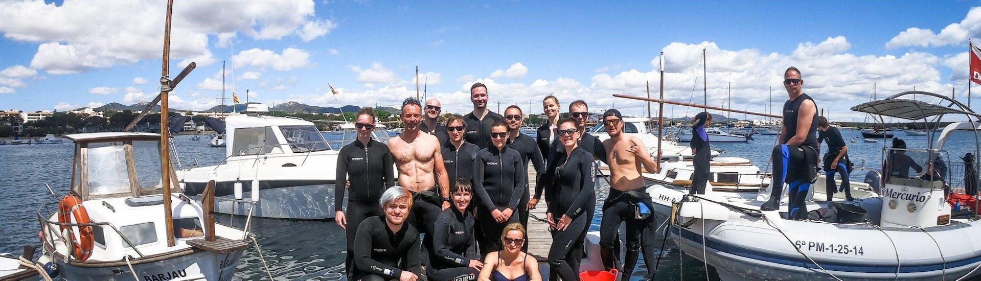 A group of divers is getting ready for a trip with East Coast Divers Mallorca.