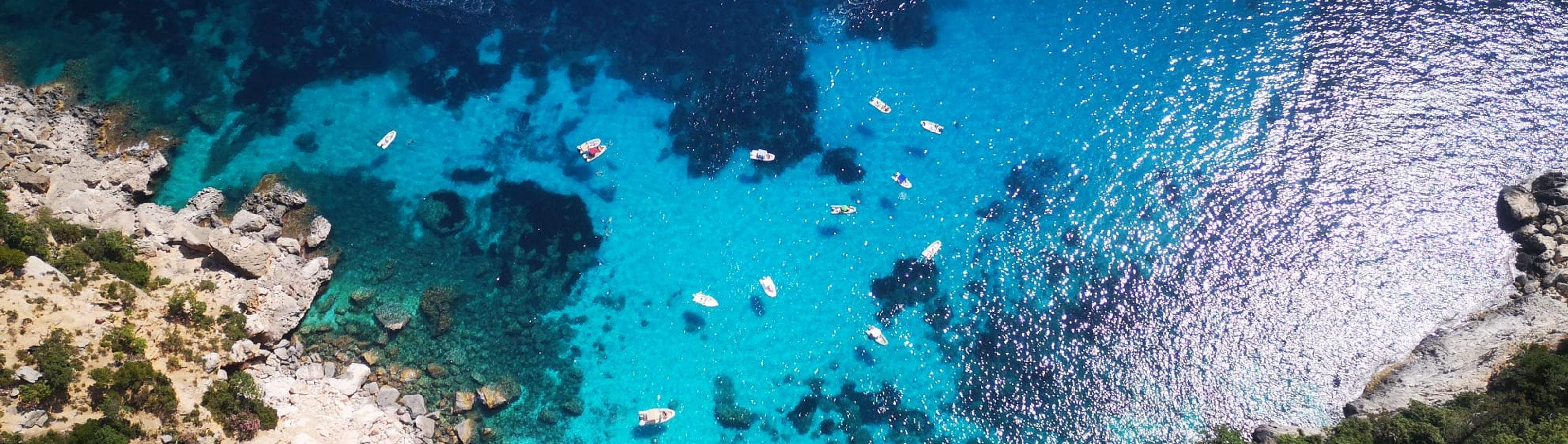 U Sardinia Ogliastra Beautiful landscapes showcasing mountains and sea, where the experiences of U Sardinia Ogliastra are taking place.