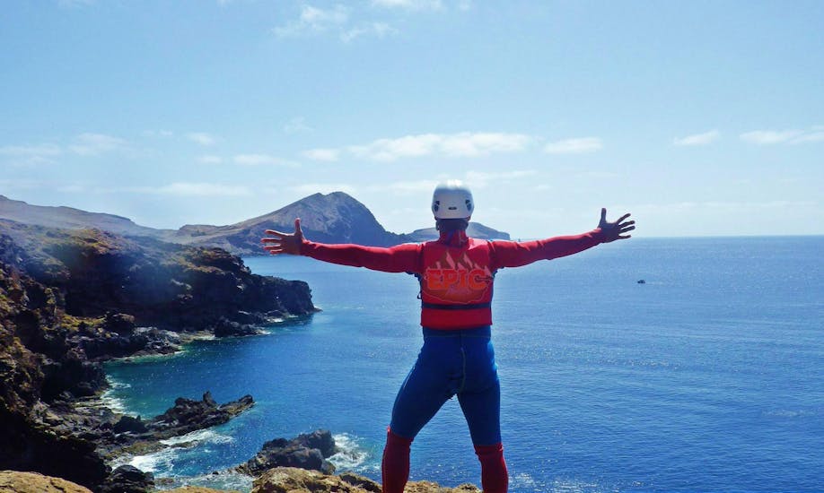 A participant of a coasteering tour with Epic Madeira is enjoying the spectacular view over Madeira's coastline.