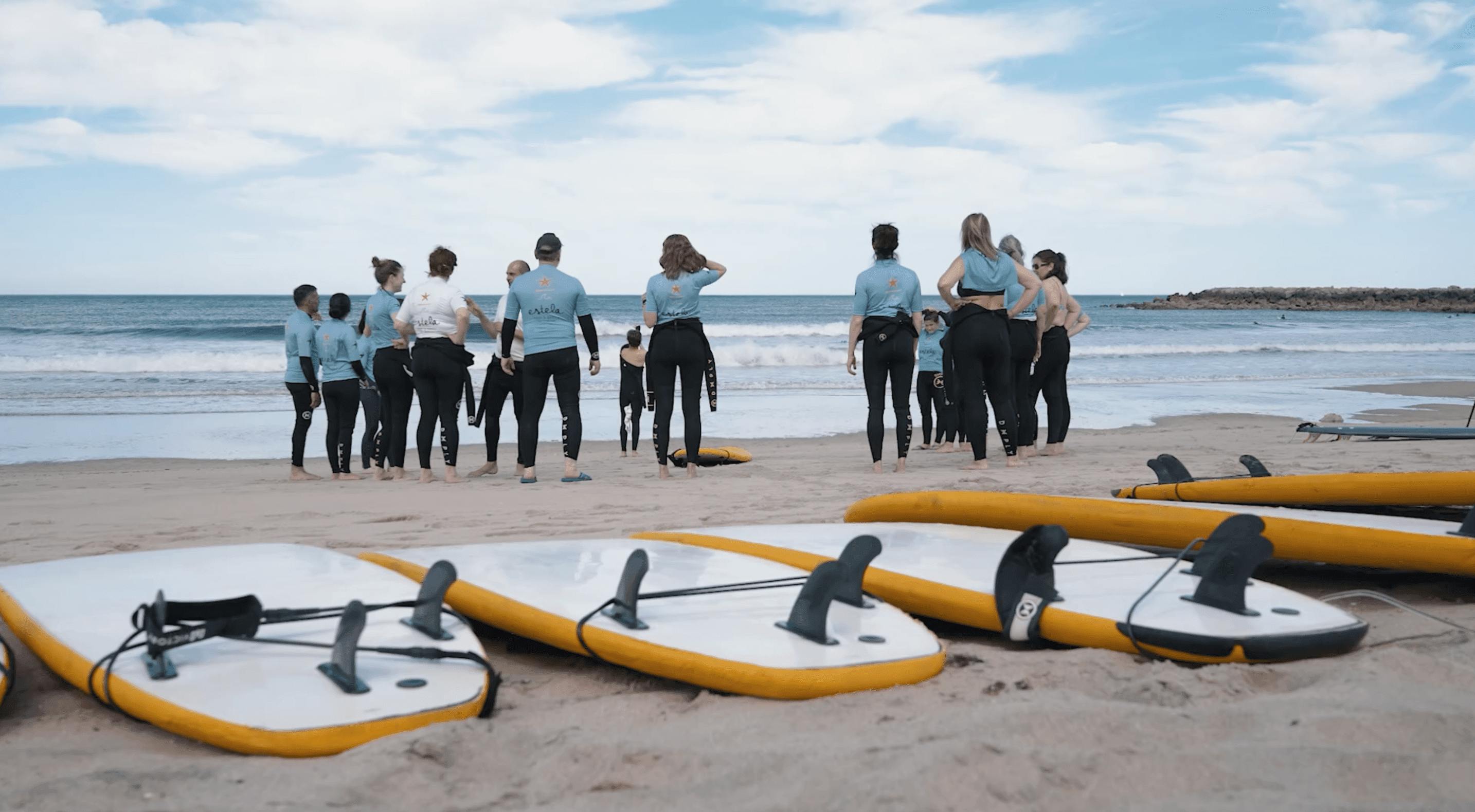 Estela Surf Porto Group of people on the beach with surfboards during surf lessons from Estela Surf Porto.
