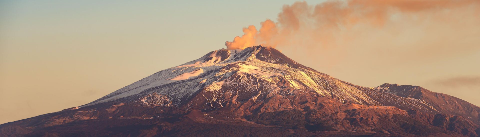 View over Mount Etna at sunset, a popular destination for volcano tours and hiking.