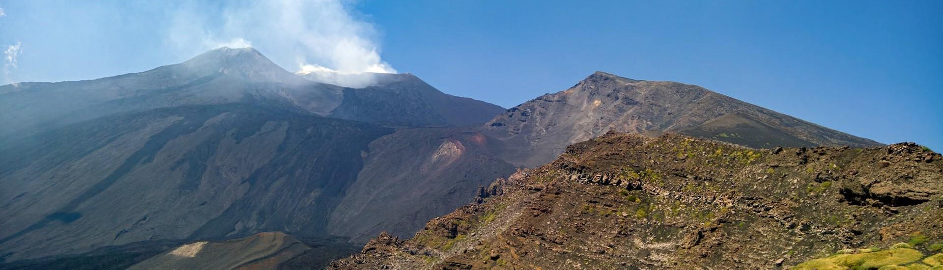 View of the top of Etna with clear sky in the background during a trip with Etna & Sea Excursions Catania.