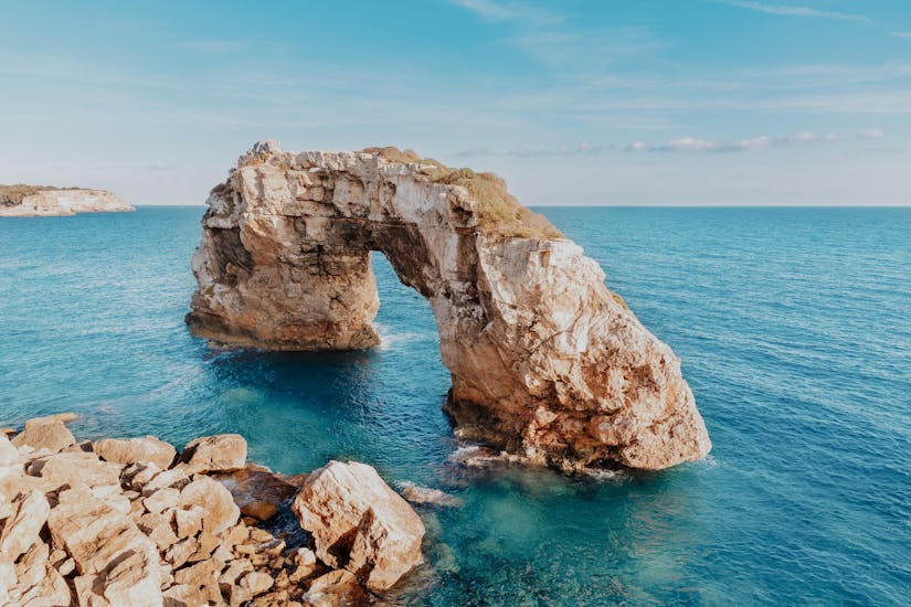 This breathtaking cove with crystal clear turquoise waters and striated rock formations is a must-visit destination on Redstar Tours Mallorca excursions.
