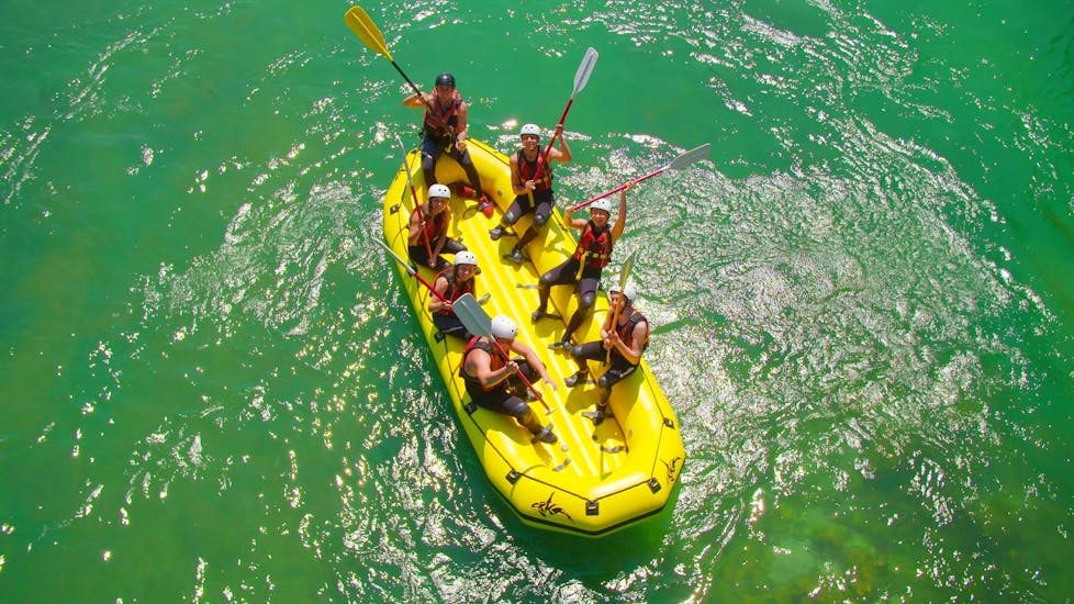 Picture of a group smiling and rafting with Fun Turist Bled.