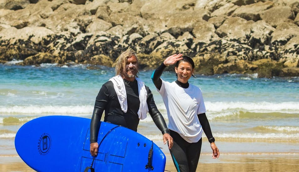 A surf instructor and a surfer from the Gecko Surf School at Praia do Norte on the Costa da Caparica.