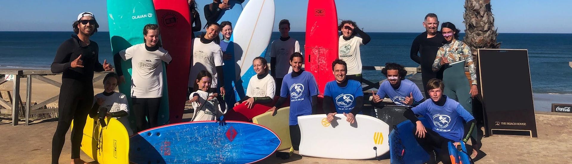 Group during their surf lessons on Lacanau Beach with HCL Lacanau.  