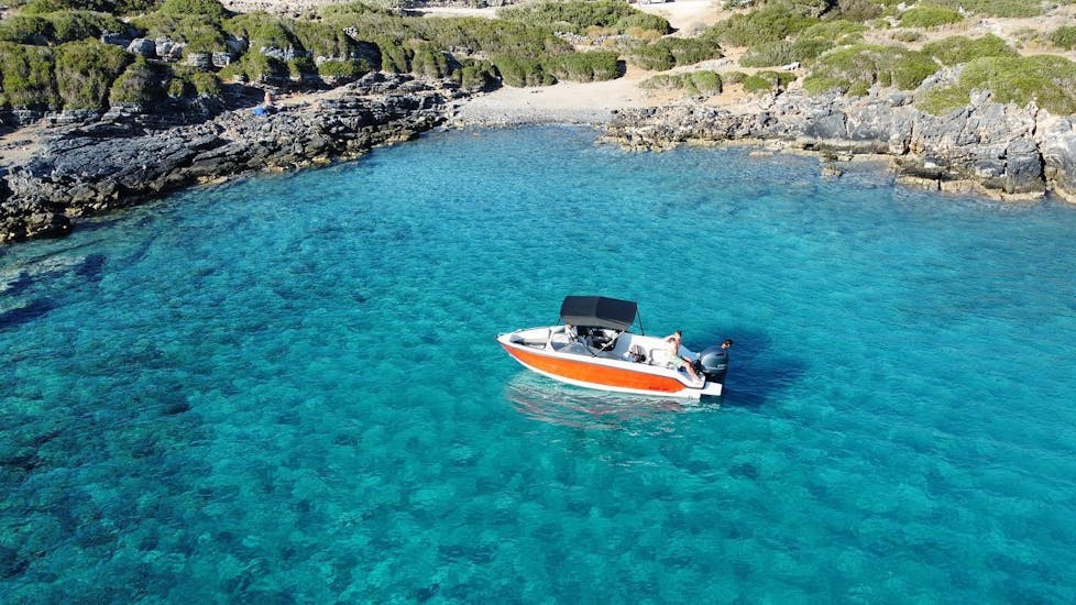 Our boat during a boat trip on the crystal clear waters with Amoudi Watersports.
