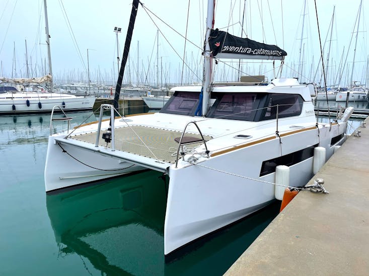 Picture of a sailing catamaran of Rent Me Charter at the port of Polignano a Mare.