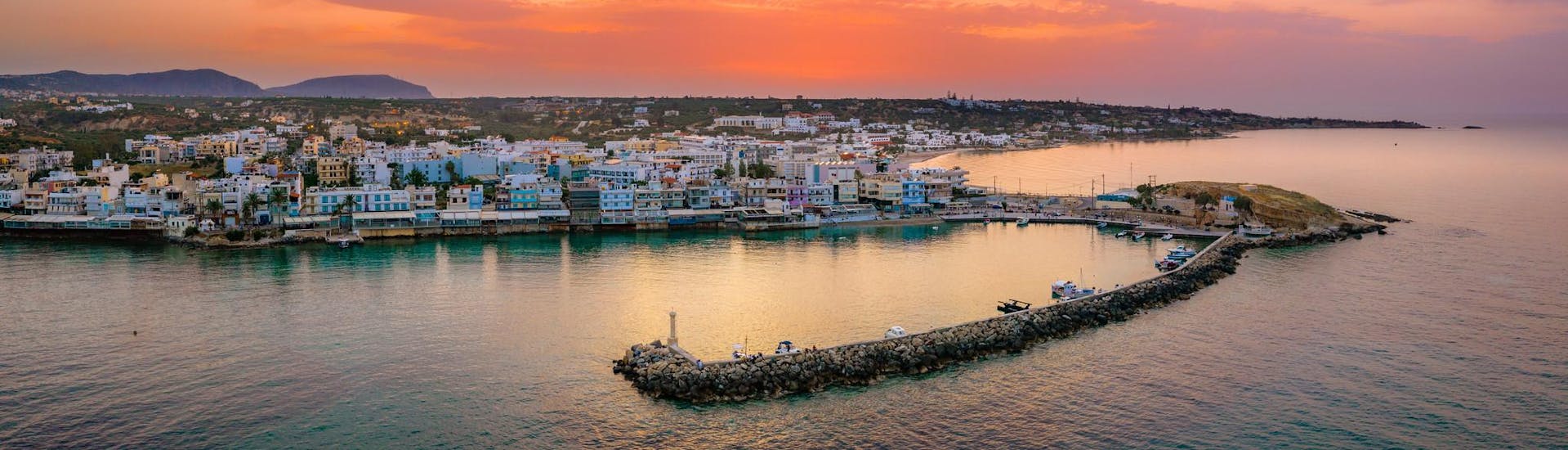 View of the coast of Hersonissos at sunset.
