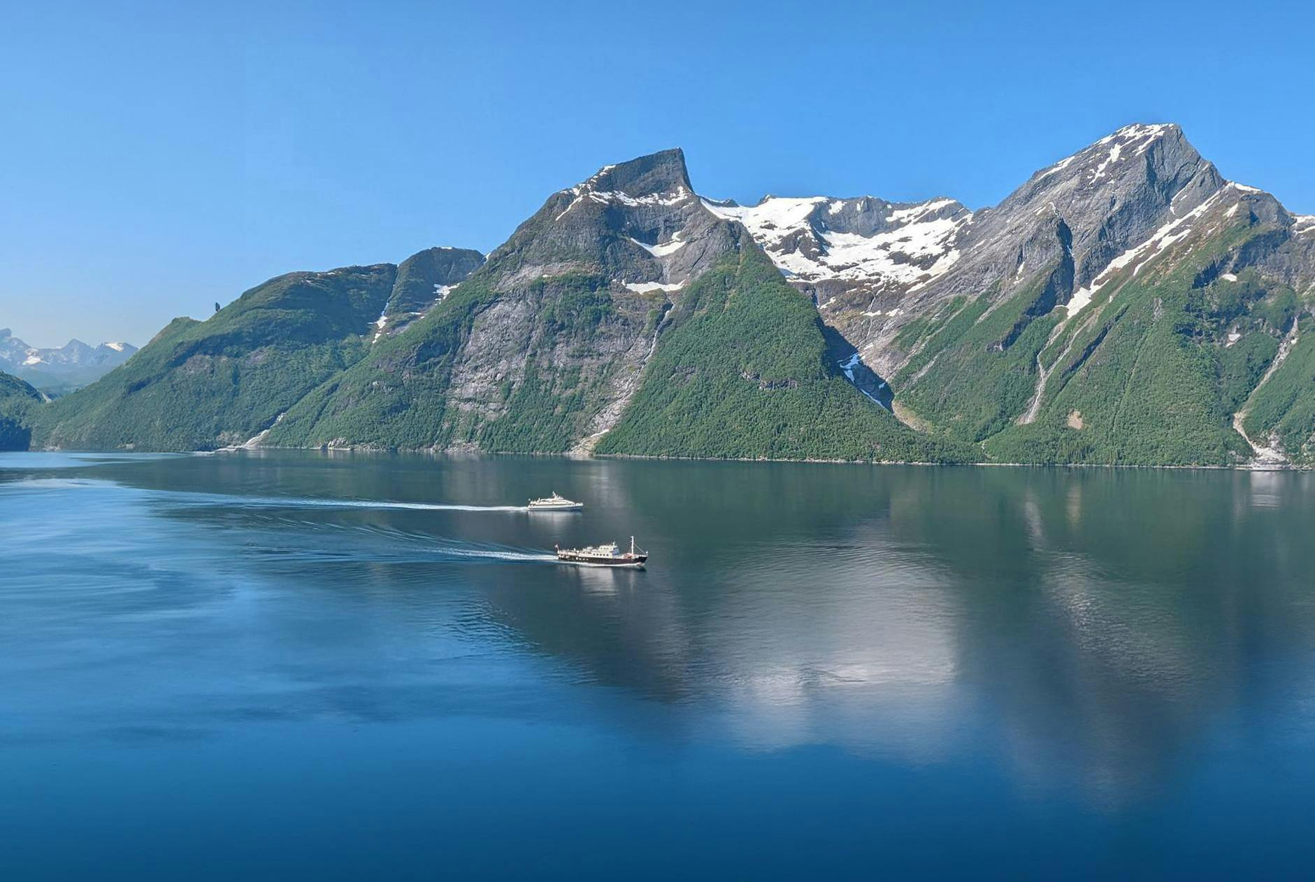 Hjørundfjord Fjord Cruise. Afternoon tour from Ålesund 2 Beautiful landscapes showcasing mountains and sea, where the experiences of Cruise Service AS are taking place.